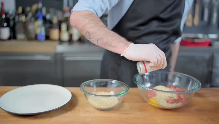Make meatballs: Combine ground beef, eggs, panko, garlic powder, milk, and oregano.