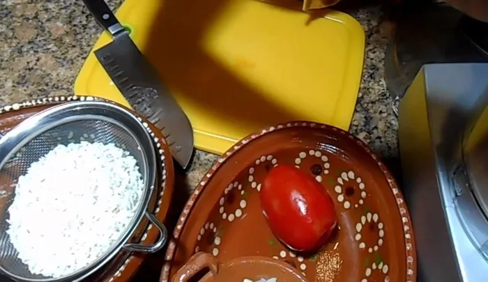 Cut ½ an onion and 2 garlic cloves. Process them in a food processor along with 2 ripe Roma tomatoes. Don't strain; use the mixture as is.