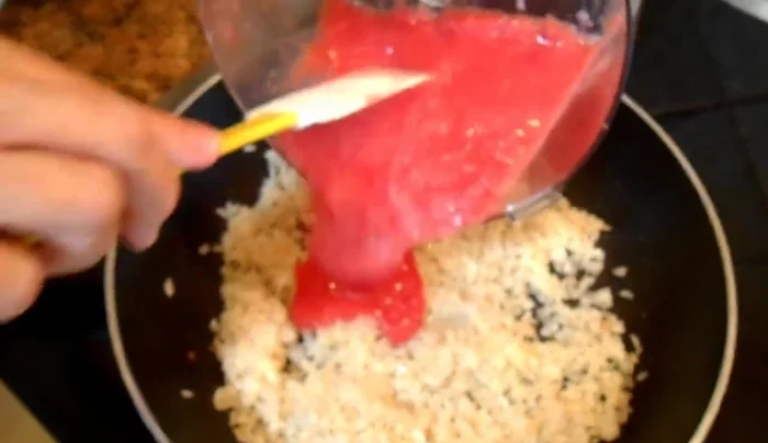 Add the pureed tomato mixture to the skillet and fry until cooked.
