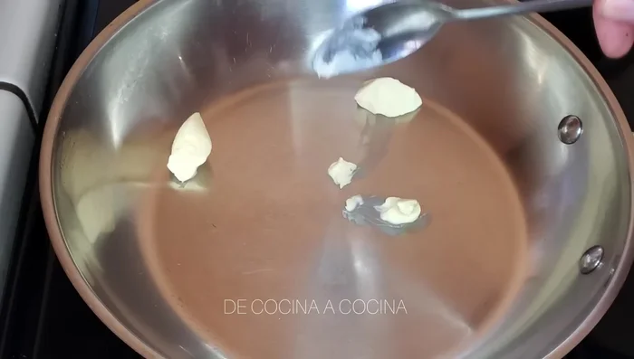 In a pan, melt butter and olive oil. Add onion and cook for 2 minutes until translucent.
