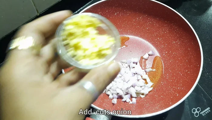 In a pan, sauté onions, crushed garlic, and ginger. Add bell peppers and corn; cook until softened. Add sugar, pepper powder, chopped tomatoes, tomato ketchup, and red chili sauce. Mix well.