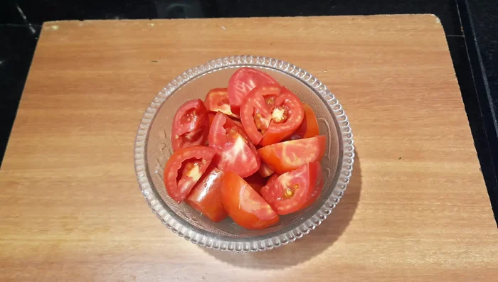 Roughly chop the tomatoes. Prepare tomato soup using a soup maker. Add tomato pieces, salt, ginger, and 2 cups of water to the soup maker. Blend on the smooth mode for 19 minutes.