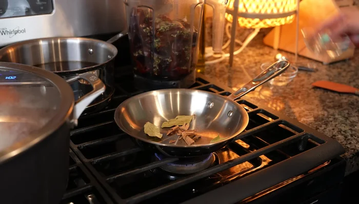 Toast 4 bay leaves and 1 cinnamon stick until fragrant and add to the blender.