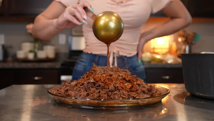 Pour some of the consome over the shredded meat (or return the meat to the pot).