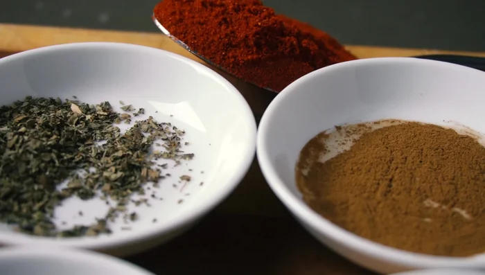 Season the meat: Crush garlic cloves and salt in a mortar and pestle. Add smoked paprika, cumin, oregano, cinnamon, black pepper, and fennel seeds (optional) to create a spice paste.