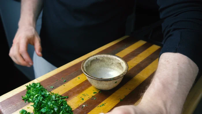 Prepare the topping: Finely dice onions, mint, and cilantro. Mix with lemon juice and a pinch of salt.