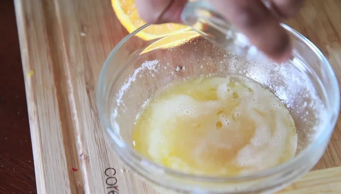 Add orange juice, lime juice, lemon juice, garlic powder, salt, pepper, and a little honey (optional) to the brown butter sauce. Stir well.