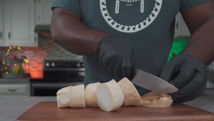 Cut king oyster mushrooms into smaller pieces.