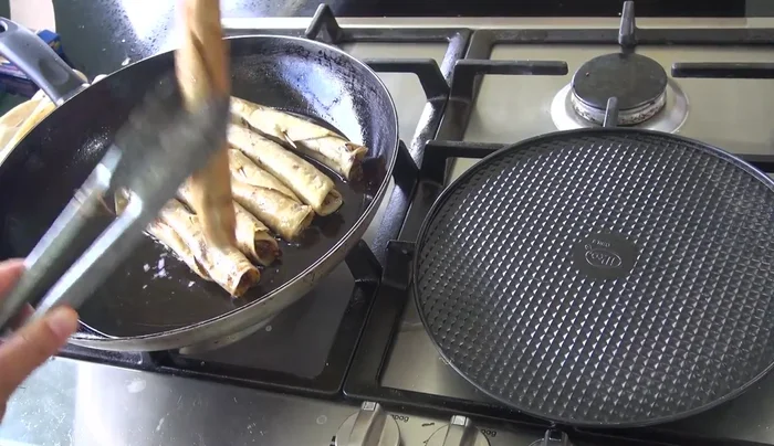 Remove the tacos and place them on a plate or rack to drain excess oil.