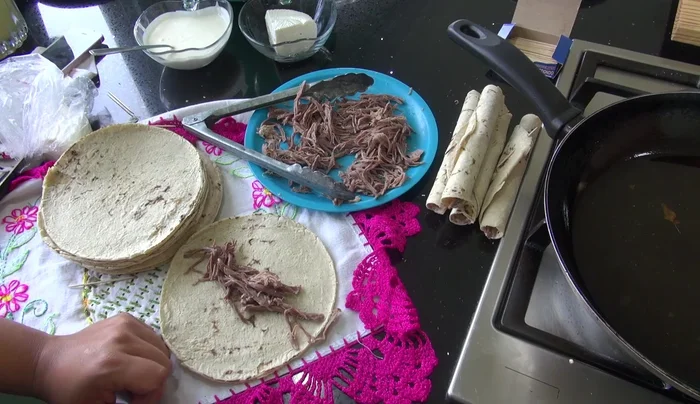 Fold the tortilla in half, securing it with a toothpick.