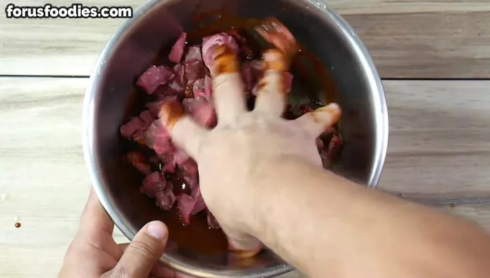 Add the meat to the marinade, mixing thoroughly with your hands (or a spoon).