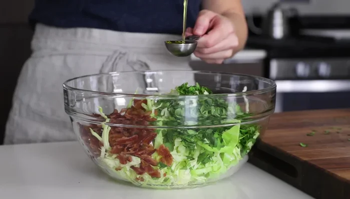 Prepare slaw dressing: Whisk together lime juice, olive oil, salt, and pepper. Add to slaw and stir. (189.36)