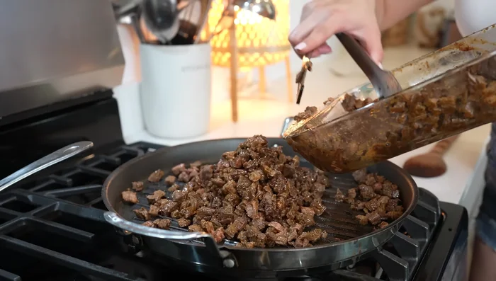 Finish cooking: Return chopped beef to the pan and cook for 3 minutes. (394.139)