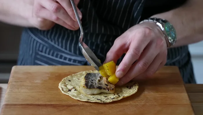 Assemble the grilled fish tacos: Warm tortillas. Fill with grilled fish, pineapple relish, avocado, radishes (optional), and cilantro (optional).