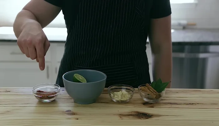 In a bowl, combine ground coriander, cumin, paprika, and salt.