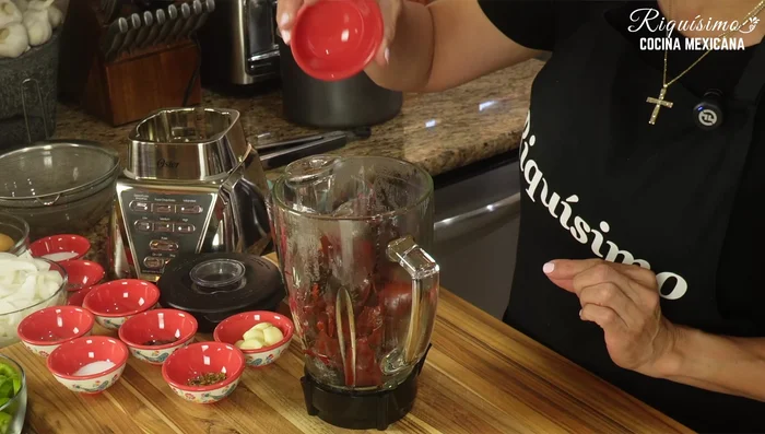 Blend the boiled chiles with remaining garlic, cilantro, oregano, peppercorns, cumin, and salt.
