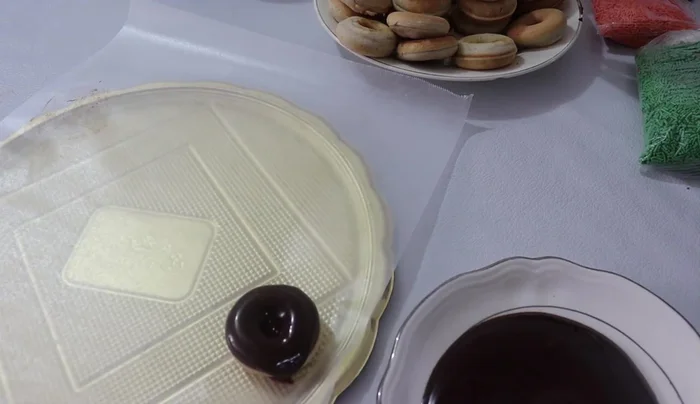 Decorate: Dip each mini donut into the chocolate ganache and then decorate with sprinkles of your choice.