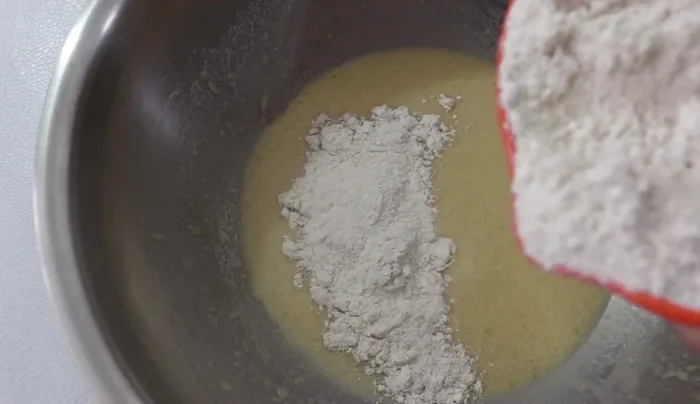 Combine wet and dry ingredients: Gradually add the dry ingredients to the wet ingredients, mixing until a smooth dough forms. Avoid overmixing.