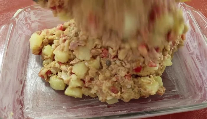 Pour the tuna mixture into the prepared dish (314.8)