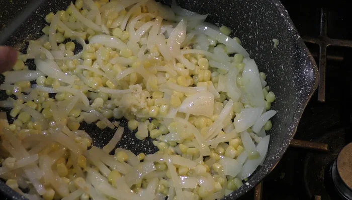 Add the poblano pepper strips and garlic (384.6).