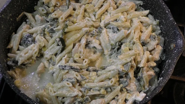 Add the cooked pasta and chicken broth. Add more broth if needed to adjust consistency (500.36).