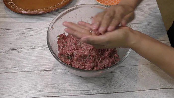 Form the meatballs, using a little water in your hand to prevent sticking.