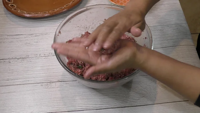 Blend tomatoes, one serrano chili, and garlic with a little water and salt (4 cloves of garlic and ½ teaspoon of salt).