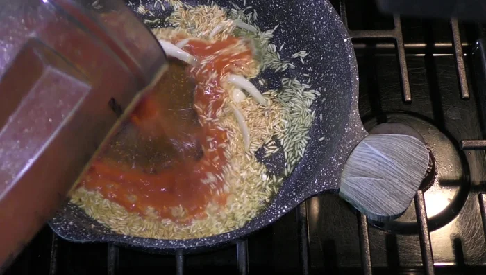 Add the blended tomato-chile sauce to the fried rice and cook for 5 minutes.
