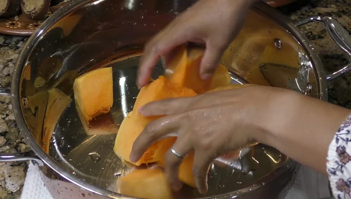 In a pot, combine the pumpkin pieces, piloncillo (adjust amount to your desired sweetness), cinnamon sticks, orange juice, and water.