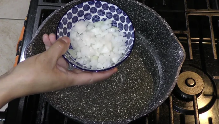 Fry the chopped onion in a little oil until browned.