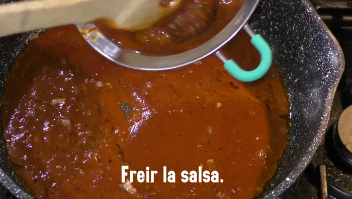 Add the cooked beans to the sauce and simmer for 12 minutes, mashing them into a puree.