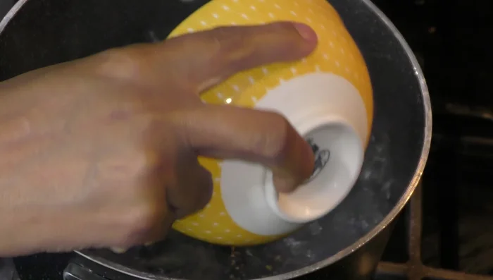 Cook pasta in boiling water with onion, garlic, oil, salt, and bay leaves until al dente.