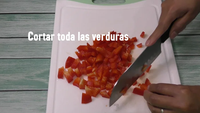 Chop vegetables (green pepper, red pepper, celery, purple onion, cilantro, serrano pepper, carrots).