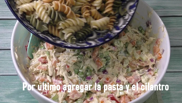 Add cooked pasta and cilantro. Mix well.