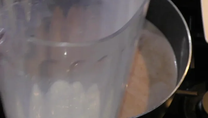 Reserve a bit of milk to blend with the toasted almonds and cookies.