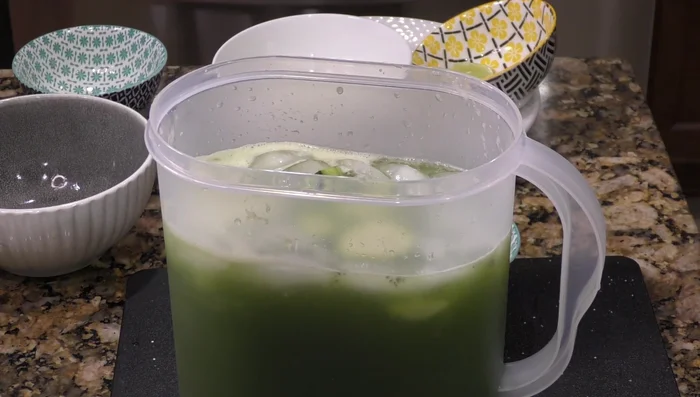 Stir well to combine. Garnish with lemon and cucumber slices.
