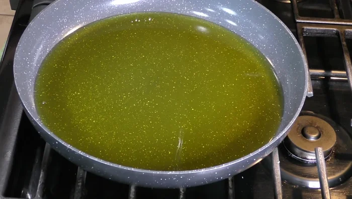Heat enough oil in a frying pan. [207.239]