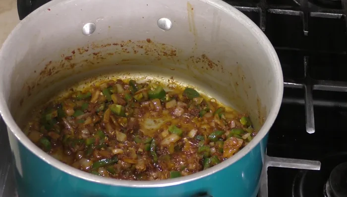 Add jalapeño peppers and cook for a few minutes.
