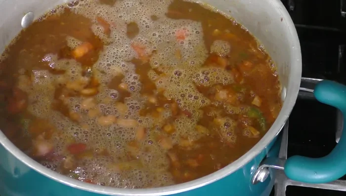 Add the cooked beans to the mixture.