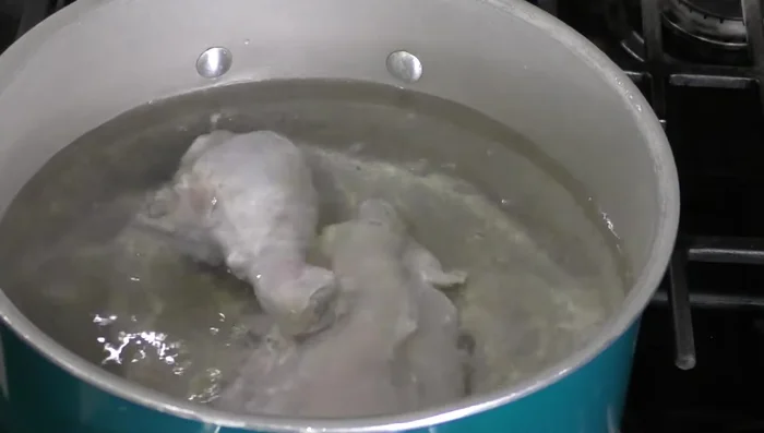 Boil chicken with onion, celery, cilantro, and garlic until cooked (196.4).