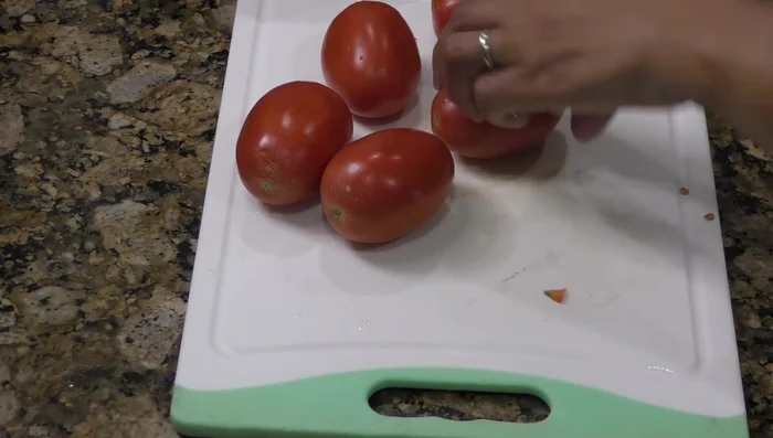Fry tomatoes, onion, guajillo chilies, and garlic (235.76). Add water and simmer until cool enough to blend (307.16).