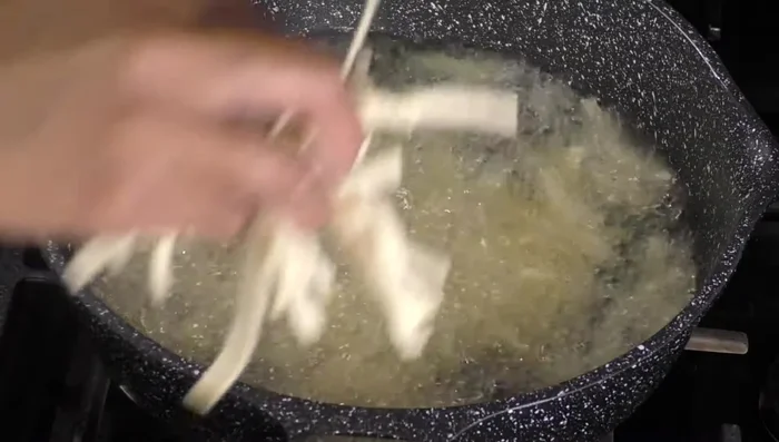 Fry tortilla strips until golden brown (587.56).