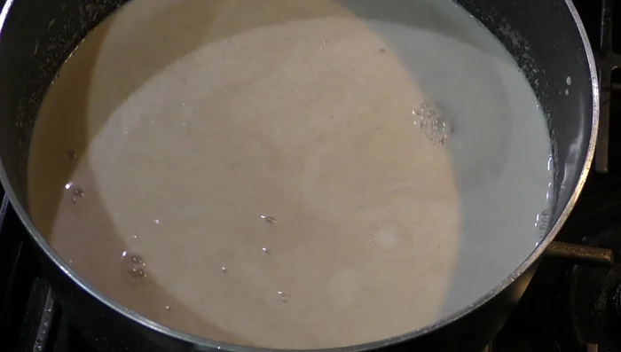 Bring the mixture to a boil, stirring frequently to prevent sticking. [150.78]