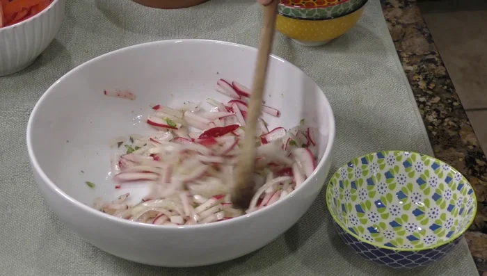 Add a little salt, and mix in the cooked nopales and tomatoes.