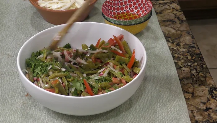 Add chopped cilantro and mix thoroughly. Add almost two tablespoons of olive oil.