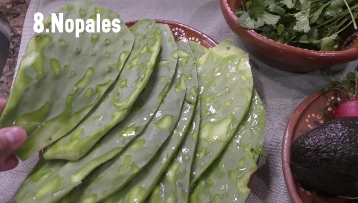 Clean and cut the nopal stalks into strips.