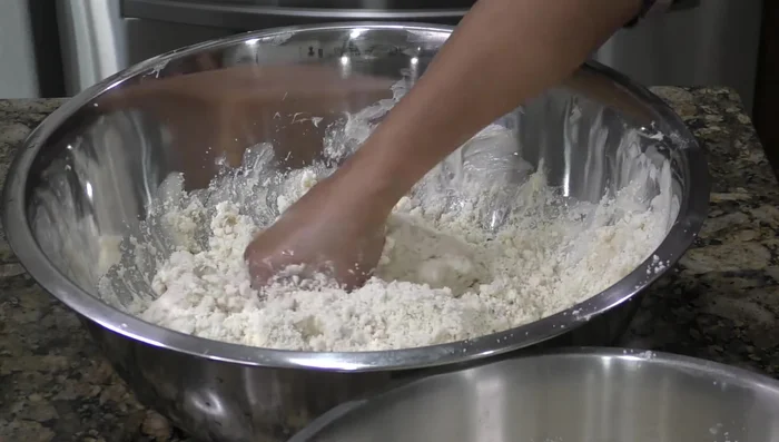 Beat lard, then mix in the masa harina, broth, and reserved sauce until well combined. Add salt and baking powder.