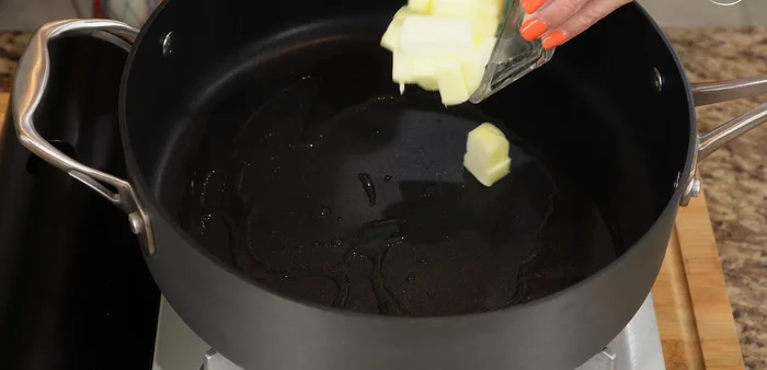 Heat olive oil in a pan. Add butter, then add the chopped garlic and cook for 30-45 seconds, stirring constantly to prevent burning.