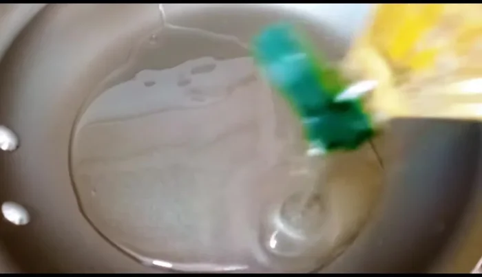 Heat oil in a frying pan. (102.96)