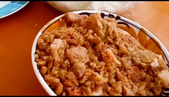 Prepare the chicharrón filling: Chop or grind the chicharrones. (158.72)